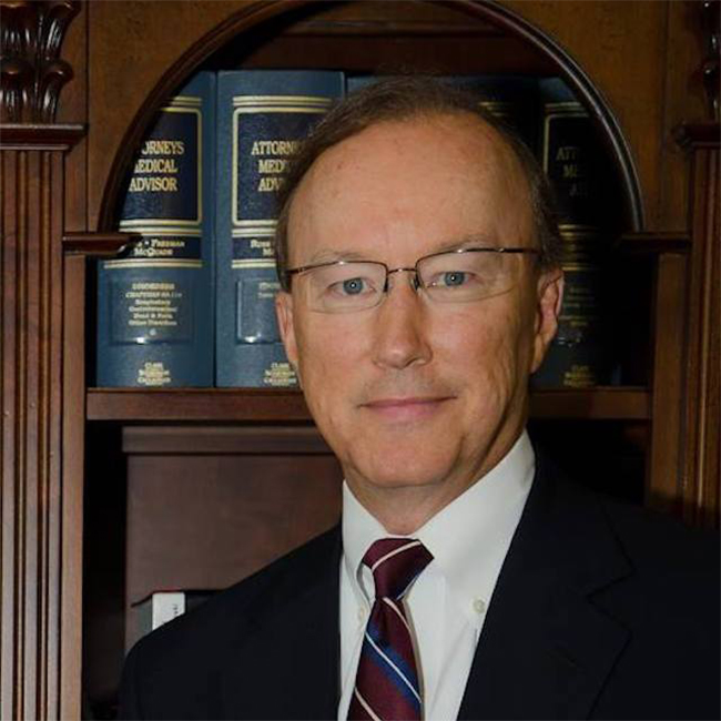 Profile photo of John E. Suthers