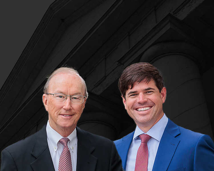 Group photo of the Law Offices of Suthers & Harper with a neoclassic building in the background